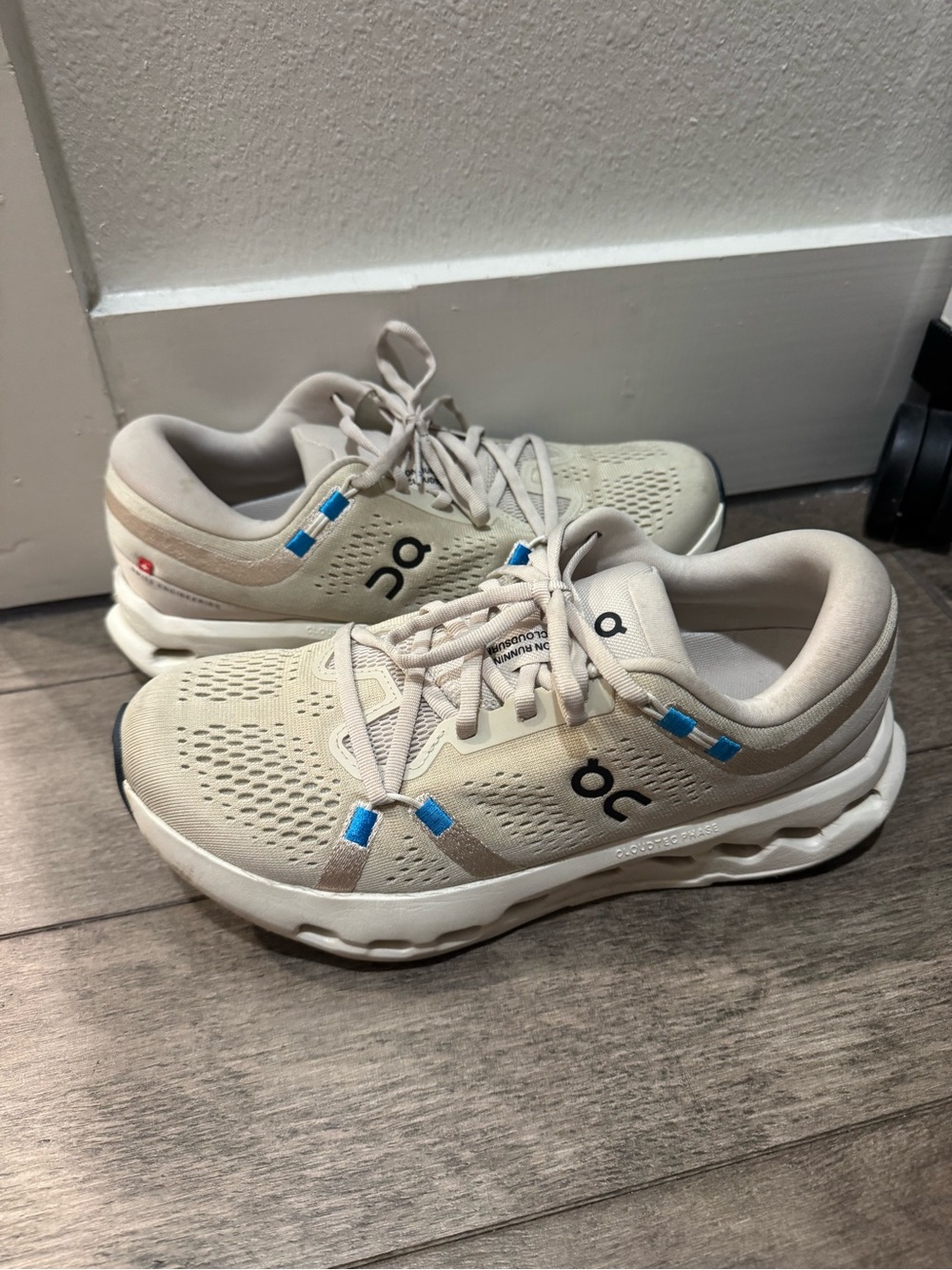 On Running Beige Sneakers with Blue Accents